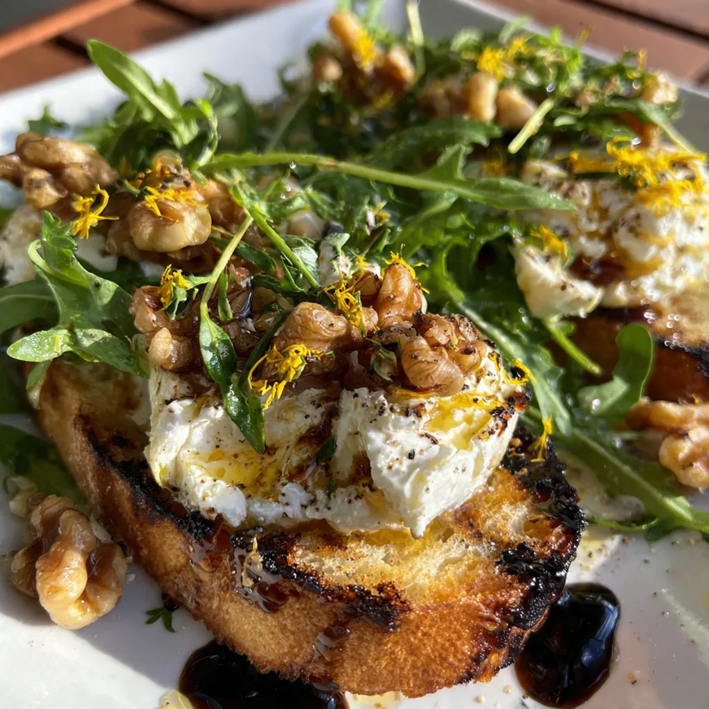 A rustic charcuterie board featuring the cheese spread surrounded by sliced apples, pears, and crackers